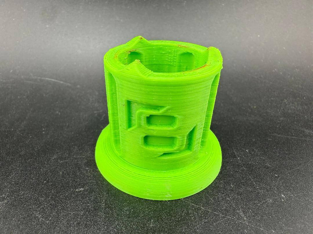 Str8 Carb Cap / Marble Stand - 3D Printed Large in bright green color on black background.
