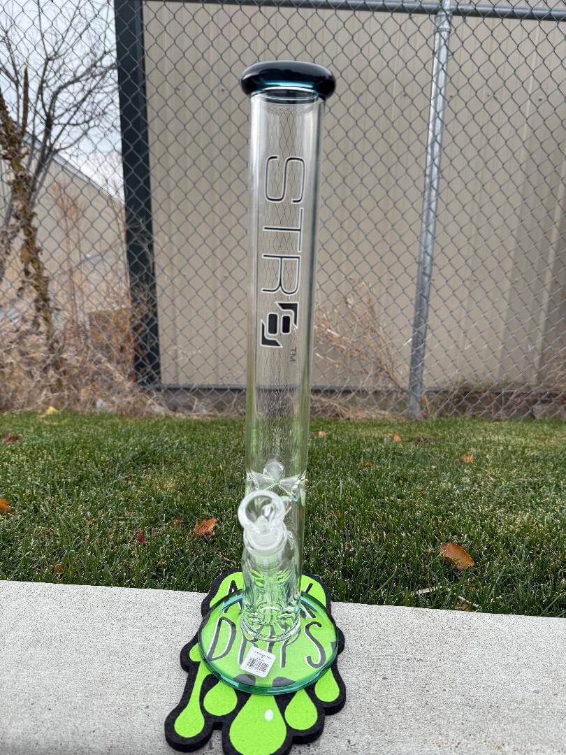Str8 Glass 18" Straight Tube 14mm 45° displayed outdoors on a green mat with unique design.