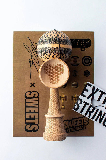 Sweets Kendama Boo Johnson Sacred model with intricate design, beech wood construction, and accessories on display.