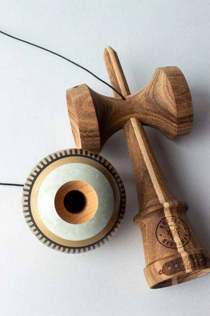 Sweets Kendama Boogie T Gold - Amped, featuring a wooden ken and shimmering gold tama with signature design.