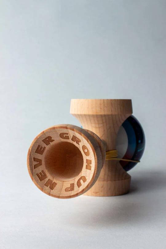 Sweets Kendama CodyGriz - Legend - Cushion featuring wood craftsmanship and colored glass.