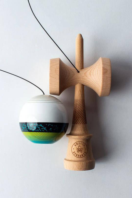 Sweets Kendama Illusion - Amped featuring white upper and colorful patterned ball, perfect for intermediate players.