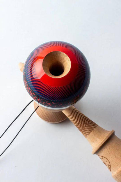 Sweets Kendama Illusion - Amped, featuring a red and blue design with beech construction for enhanced playability.