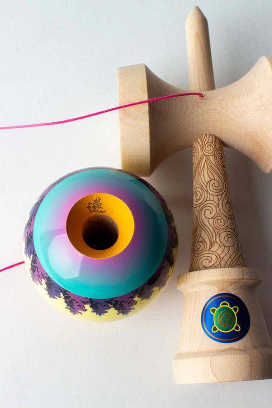 Sweets Kendama Joshua 'Flow' Grove Pro with colorful design and wooden handle, showcasing the new Sweets Legend Shape.