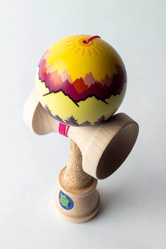 Sweets Kendama Joshua 'Flow' Grove Pro model with vibrant yellow and purple design.