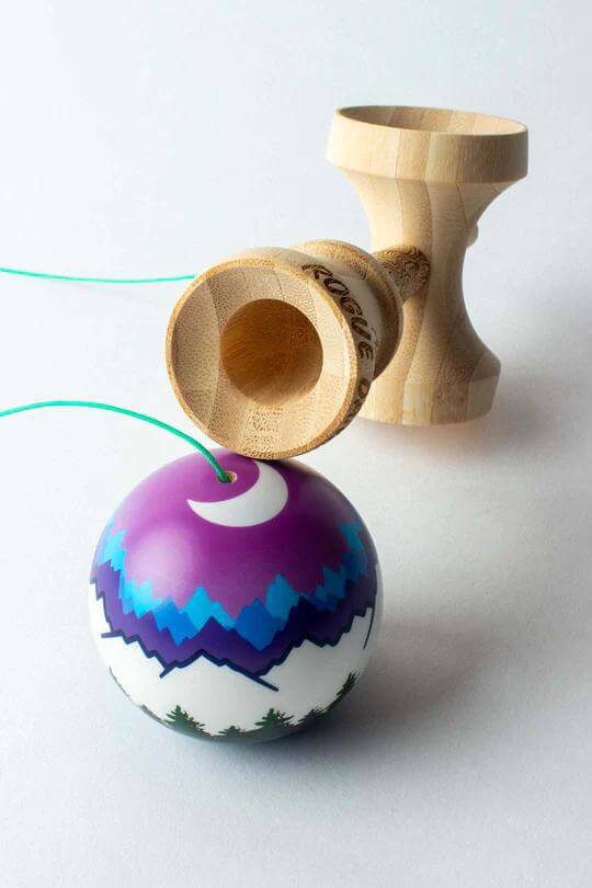 Sweets Kendama Joshua Flow Grove Pro with colorful ball and wooden handle, designed for advanced trick play.