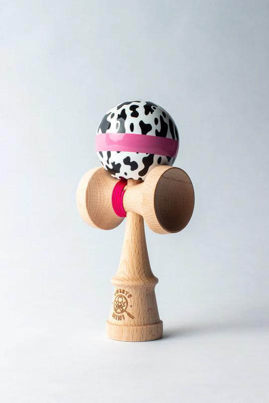 Sweets Mini Kendama in Cow Print design, perfect pocket-sized toy for tricks and creativity.