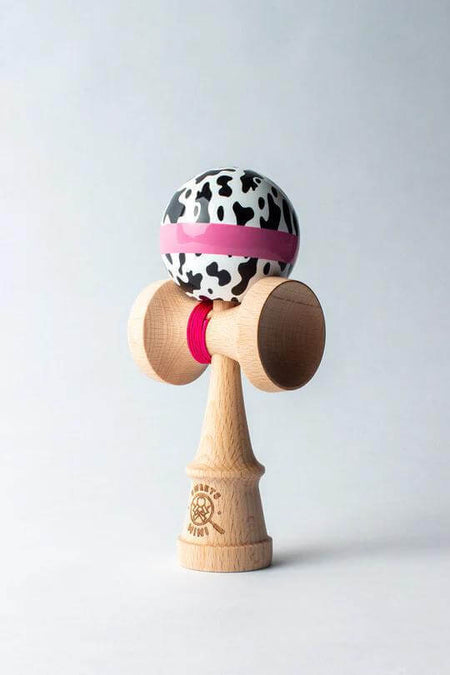 Sweets Mini Kendama in Cow Print design, perfect pocket-sized toy for tricks and creativity.