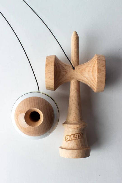 Sweets Kendama Sport Stripe Sticky Clear toy featuring wooden design and clear ball for enhanced grip and playability.