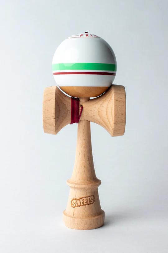 Sweets Kendama Sport Stripe Sticky Clear with wooden handle and colorful ball for skillful play.