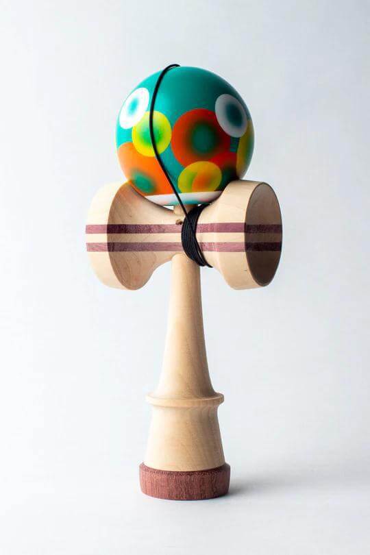 Sweets Kendama Bubbles design featuring colorful tama and birch wood ken with engraved logo, perfect for collections.