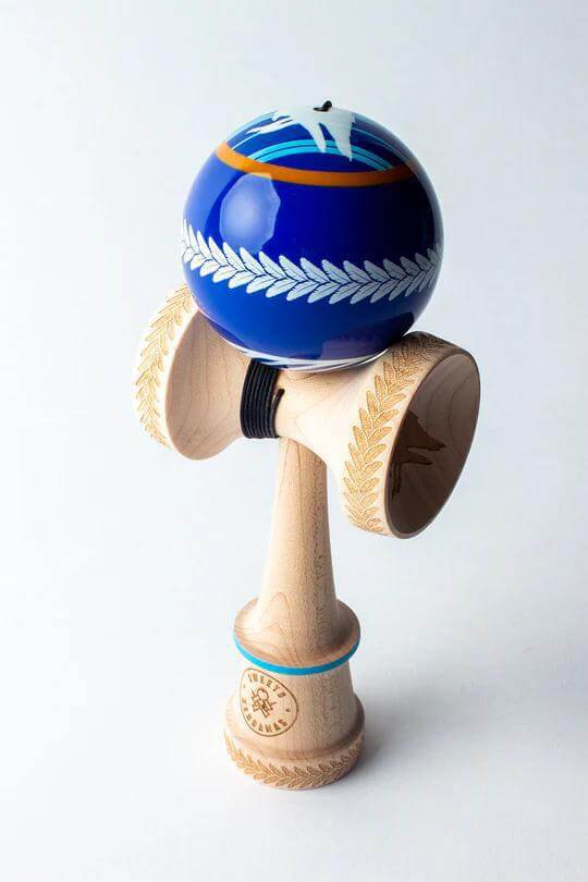 Sweets Kendama with blue and yellow design, featuring maple wood and intricate engravings for balanced play.