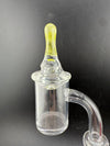 Taco Glass Directional Cap showcasing a clear banger with a yellow tip for enhanced airflow control.