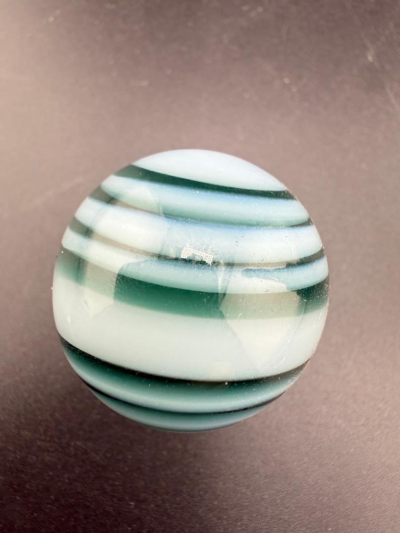 Taco Glass Marble - 2 Tone Spiral 1" showcasing a unique dual-color spiral design in borosilicate glass.