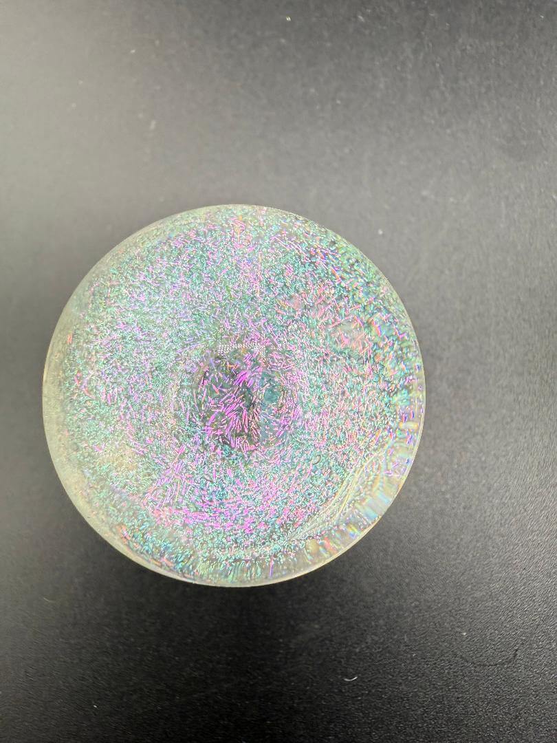 Taco Glass Marble - Fumed Dichro 1.1" with vibrant color-shifting effects and a dichroic finish.