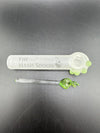 The Hash Spoon glass pipe with green herb, showcasing a unique design ideal for smoking enthusiasts.