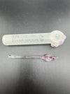 Artisan glass pipe set featuring The Hash Spoon and elegant pink detail wand for smoking enthusiasts.
