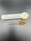 Stylish glass smoking accessories featuring The Hash Spoon pipe with unique artisan design.