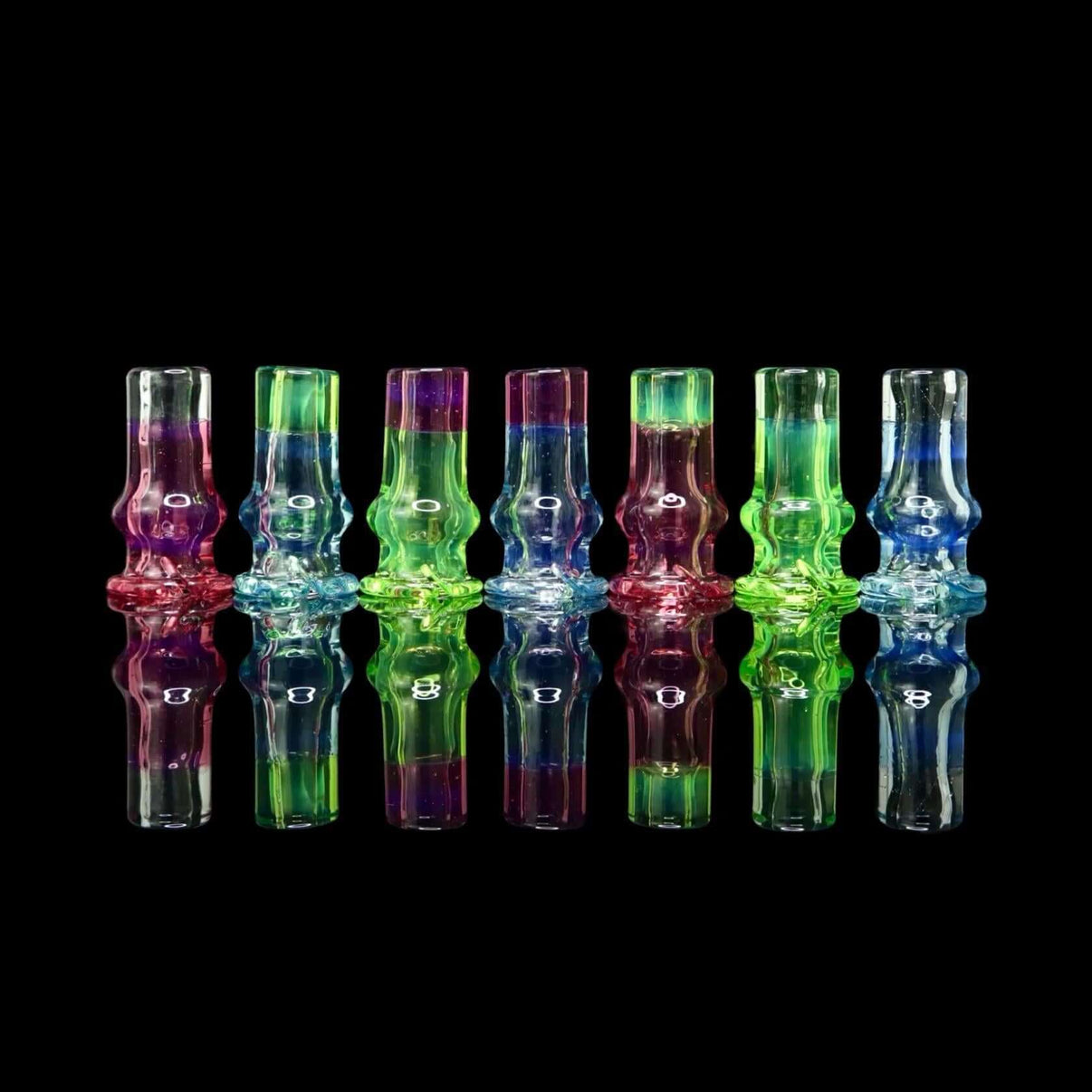 Tokr Glass Puffco Pivot Tip Glass Mouth Piece Replacment - Two Tone, colorful handcrafted mouthpieces on black background.