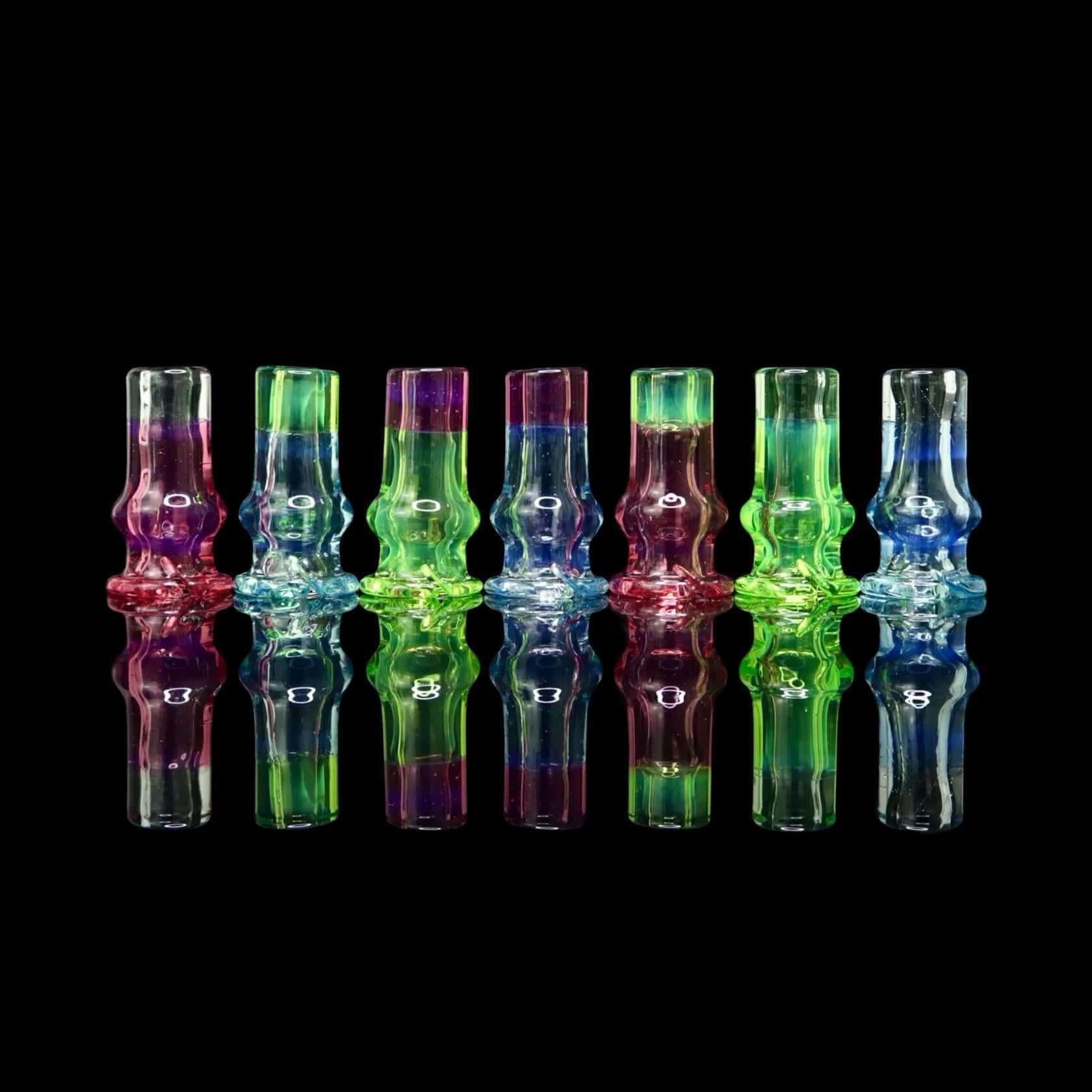 Tokr Glass Puffco Pivot Tip Glass Mouth Piece Replacment - Two Tone, colorful handcrafted mouthpieces on black background.