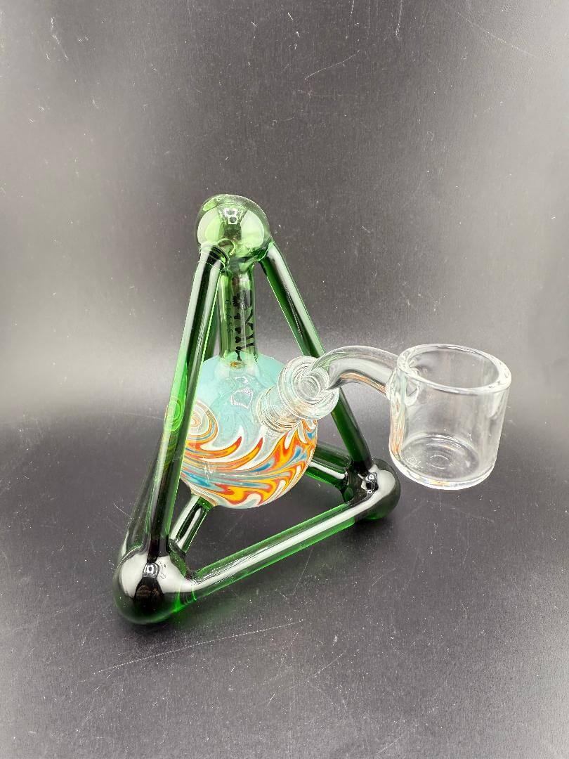 Toxic Glass Atom Rig in green with vibrant atom-inspired design and clear banger, 10mm 45° joint.