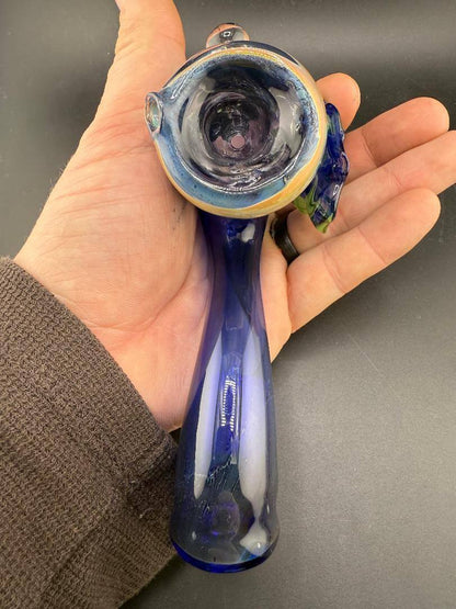 Tuck Glass Sherlock Pipe - Cobalt w/ Fume & Floral Attachment held in hand, showcasing its unique design and craftsmanship.