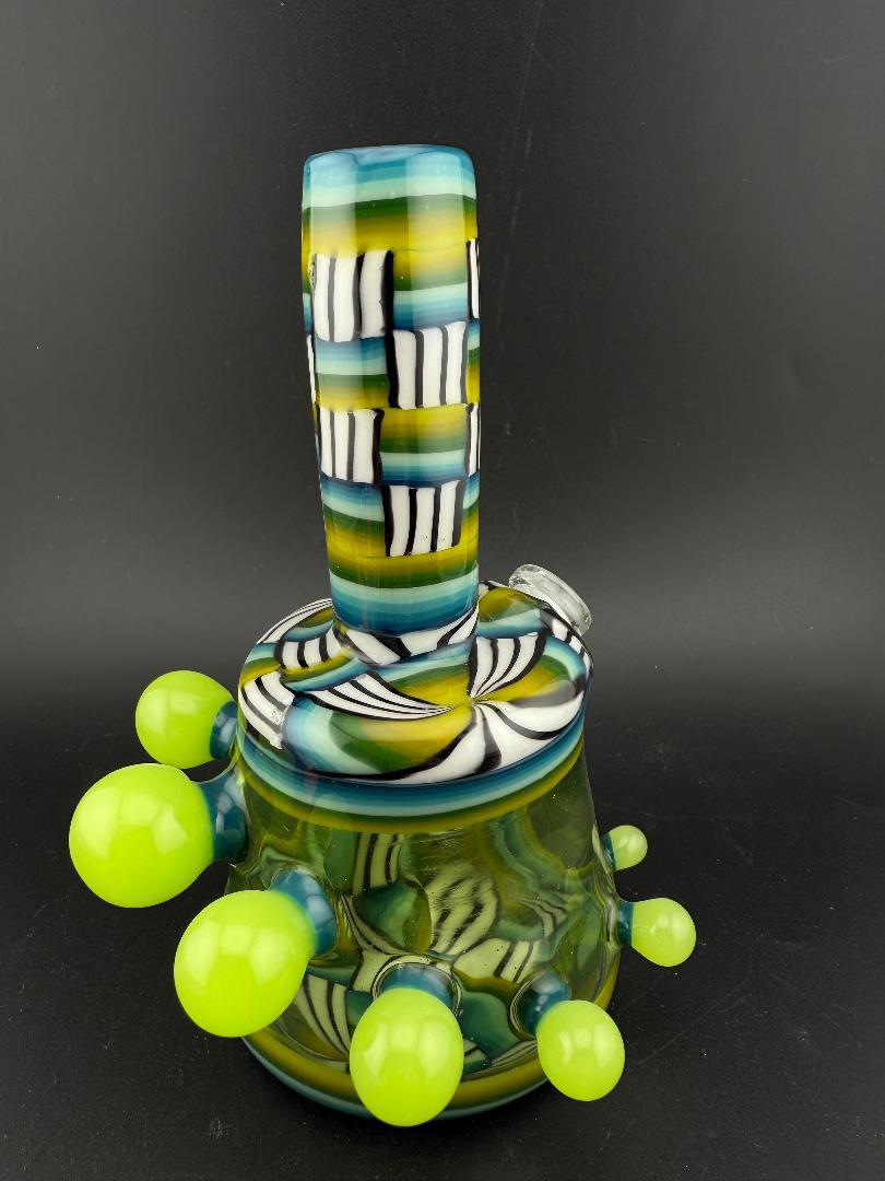 Twisted Images Glass Chip Stack Jammer Rig 14mm 45° with unique green and black pattern and smooth design.