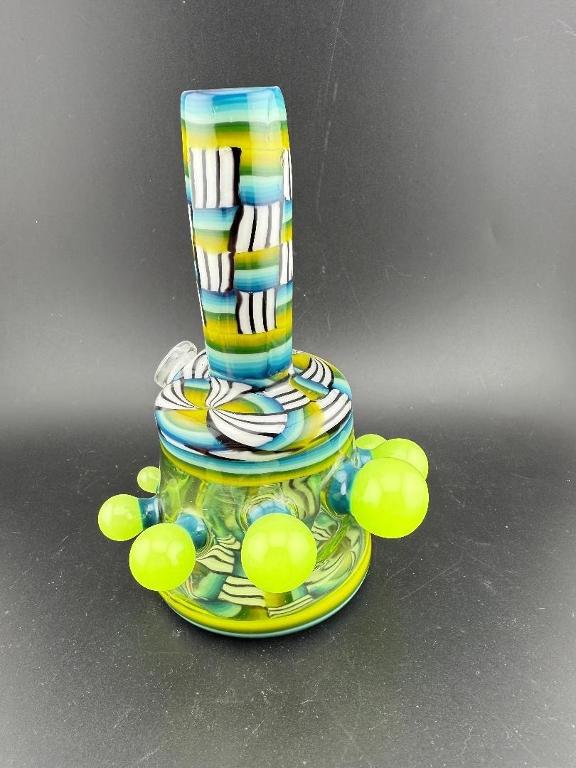 Twisted Images Glass Chip Stack Jammer Rig 14mm 45° with green colorway and black & white chip stack pattern.