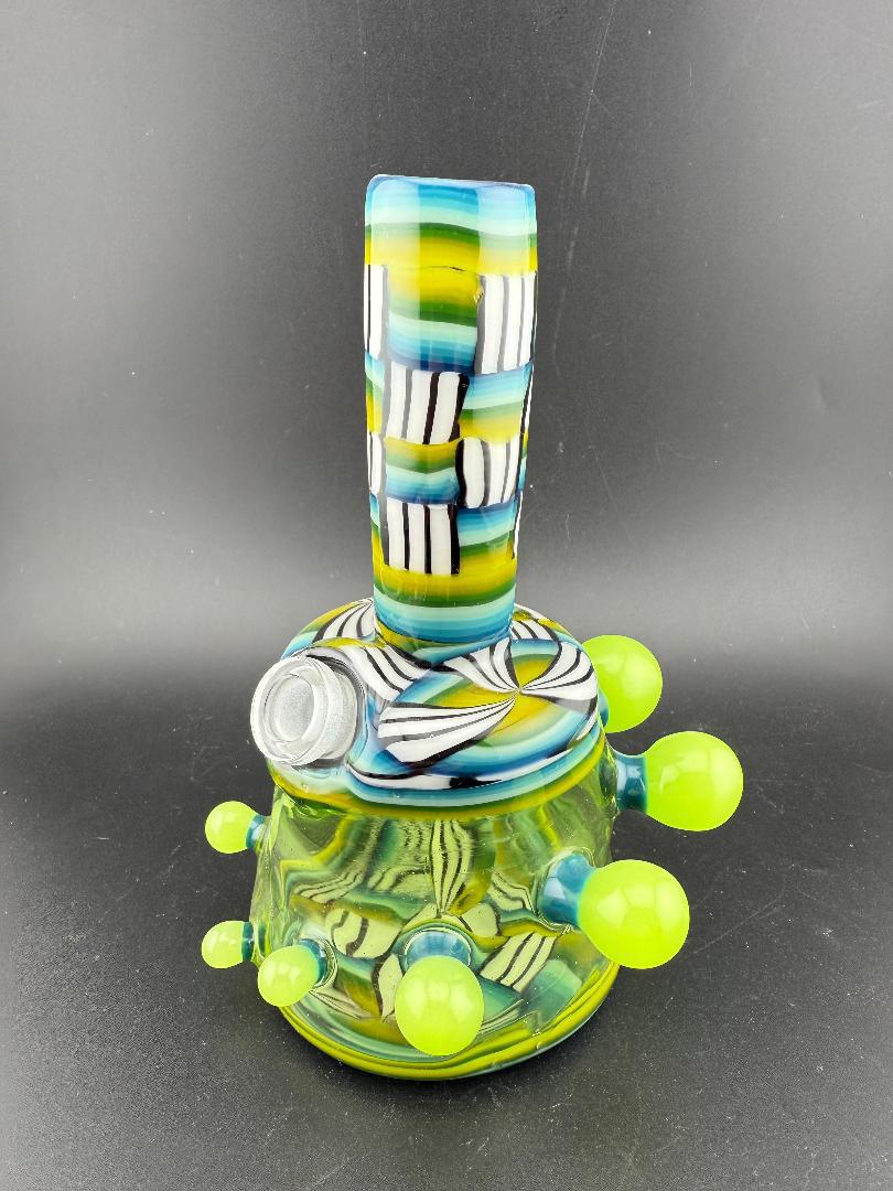Twisted Images Glass Chip Stack Jammer Rig 14mm 45° in vibrant green, black, and white artistic pattern.