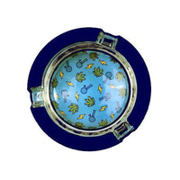 Ugly House 3" Ashtray - Pixel Art featuring colorful designs on a blue background.