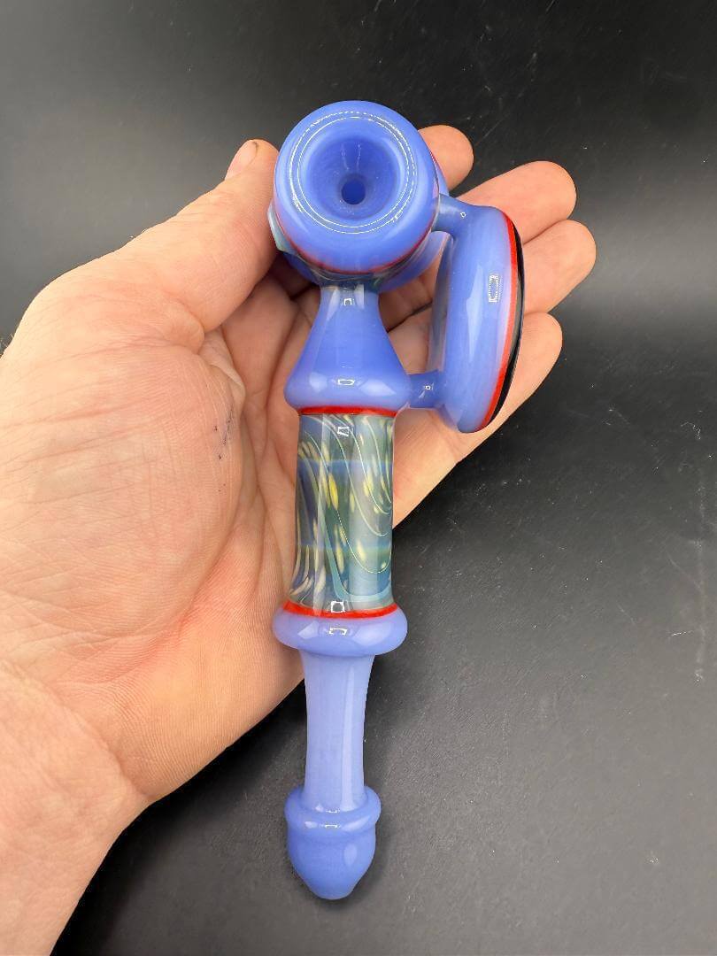 Unknown Artist Hammer Pipe - Light Blue Space w/ Large Pendant held in hand, showcasing vibrant color and design.