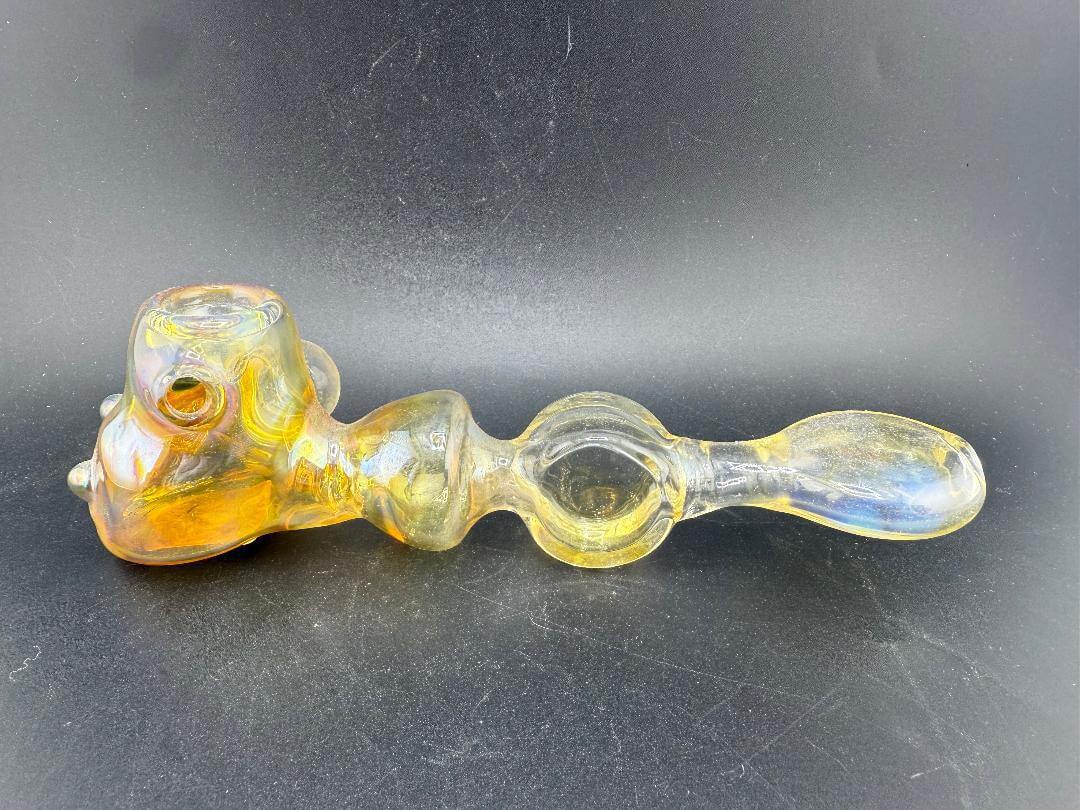 Unknow Artist Hand Pipe - Yellow Fumed vibrant borosilicate glass hand pipe with smooth airflow and compact design.