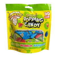 Warhead Sour Popping Candy 3.17oz package featuring green apple, watermelon, and blue raspberry flavors.