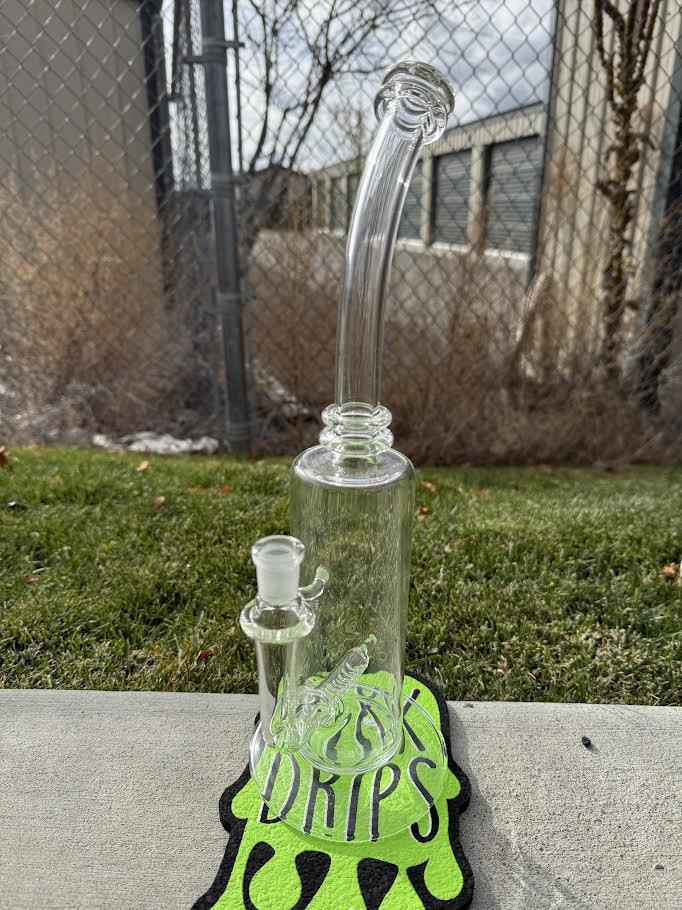 Wildfire Productions Castle Rig 14mm 90° displayed on a colorful mat, showcasing its unique glass art design.