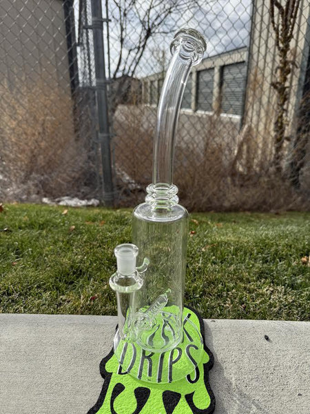 Wildfire Productions Castle Rig 14mm 90° displayed on a colorful mat, showcasing its unique glass art design.