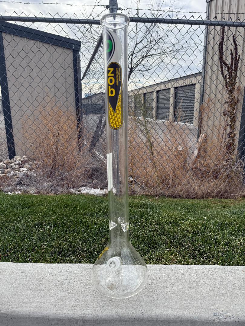 Zob Glass 24" OG Beaker Flower Piece displayed outdoors with a clear view of its design and craftsmanship.