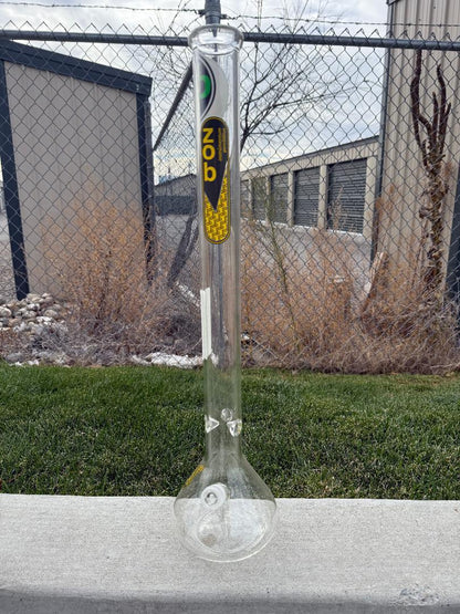 Zob Glass 24" OG Beaker Flower Piece displayed outdoors with a clear view of its design and craftsmanship.