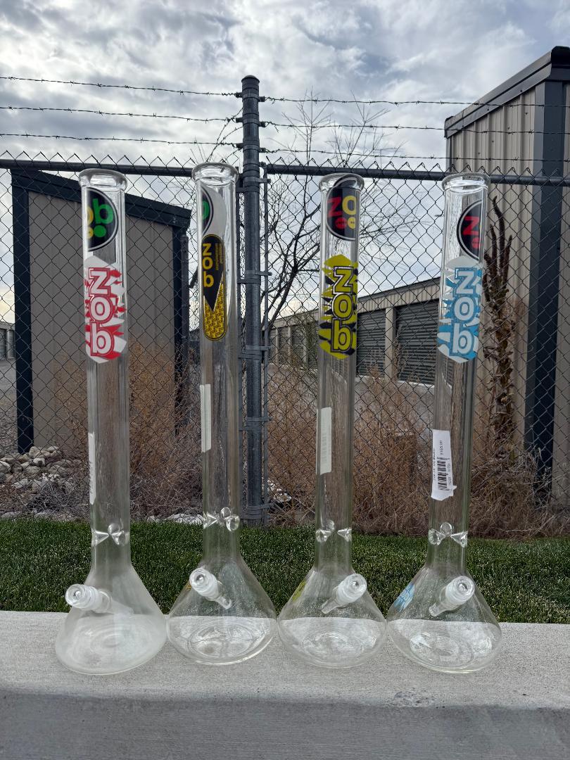 Zob Glass 24" OG Beaker Flower Piece collection displayed outdoors, showcasing classic design and craftsmanship.