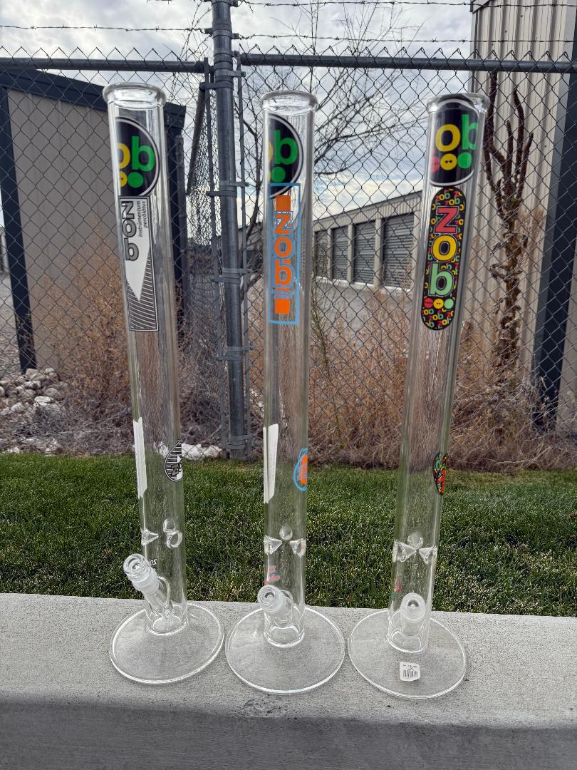 Zob Glass 24" Straight Tube Flower Piece displayed outdoors, showcasing its clean design and high-performance features.